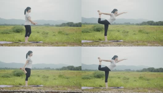 年轻的亚洲白种妇女进行精神瑜伽冥想姿势瑜伽平衡在美丽的山景在早晨日出。高清在线视频素材下载