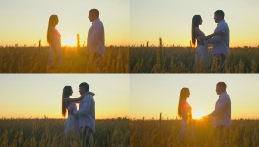 浪漫的年轻幸福的夫妇剪影在金色的麦田日落。女人和男人在阳光下拥抱亲吻，太阳镜头的光晕。爱，幸福的家庭，自然，户外。慢镜头,120 fps高清在线视频素材下载