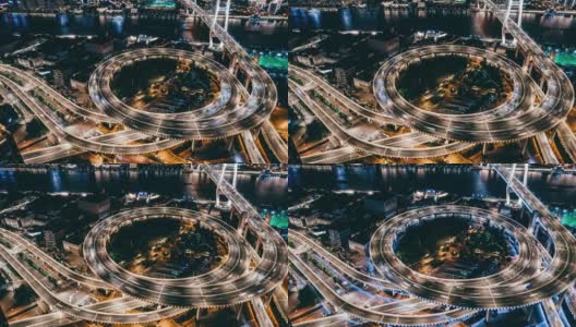 T/L无人机视角的立交桥和城市交通在夜间高清在线视频素材下载