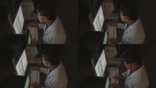 医生用电脑分析考试结果高清在线视频素材下载