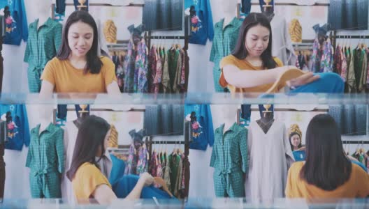 女顾客在商店里挑选衣服高清在线视频素材下载