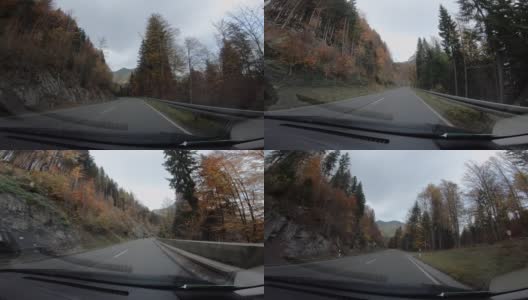 司机在高速公路上的视角，奥地利欧洲公路旅行视野从车内驾驶与自然森林景观树木和山脉高清在线视频素材下载