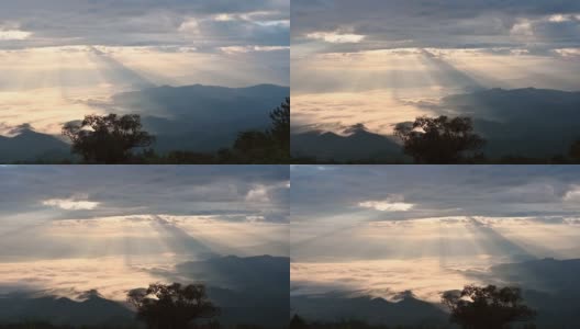 在国家公园的热带雨林里，阳光照在山峦上的壮观的天空和雾蒙蒙的景象高清在线视频素材下载