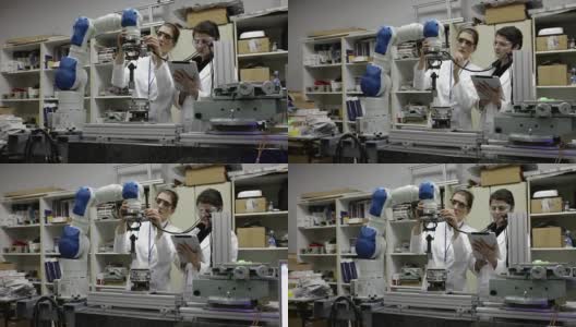 科学家使用机械臂工作高清在线视频素材下载