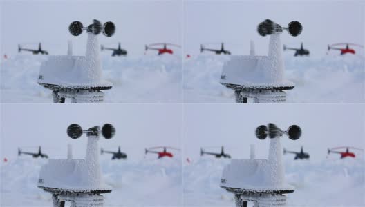 在直升机的背景下，风速计测量北极圈的极地站的风速。高清在线视频素材下载