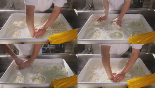 把新鲜的奶酪放进模具-日记奶酪工厂高清在线视频素材下载