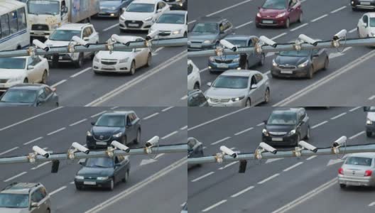 在这个大城市的道路上四个交通安全监控摄像头的特写。间隔拍摄高清在线视频素材下载