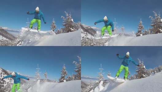 慢动作:专业滑雪板运动员骑着雪橇下坡，然后跳到空中。高清在线视频素材下载