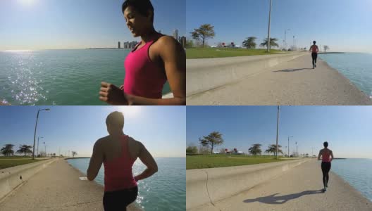 非裔美国女性在芝加哥海岸跑步高清在线视频素材下载