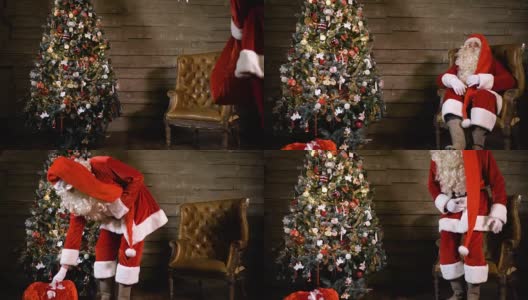圣诞老人坐在圣诞树旁，拿着一个装满礼物的袋子高清在线视频素材下载