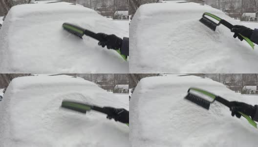女人开始从被雪覆盖的汽车上清除积雪高清在线视频素材下载