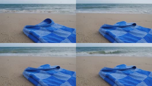 沙滩上的蓝色毛巾高清在线视频素材下载