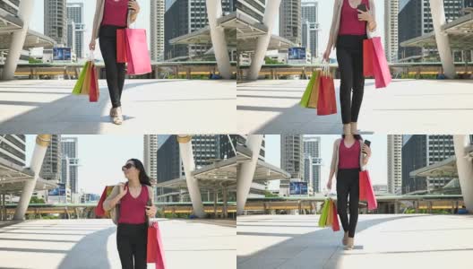 女人走路和购物日购物袋高清在线视频素材下载