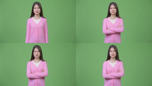 年轻美丽的亚洲女人双臂交叉高清在线视频素材下载