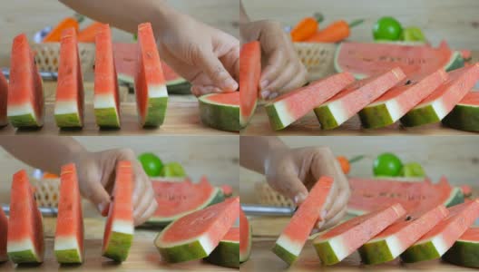 Close up shot hands of woman arranging a piece ripe watermelon on wooden cut board fresh  fruit for summer高清在线视频素材下载