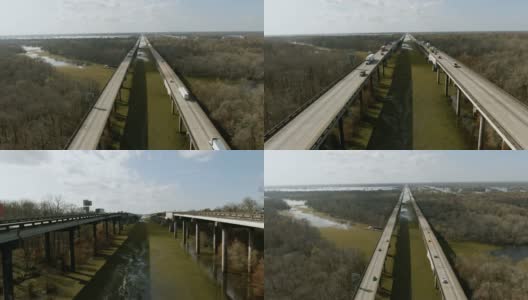 在阳光明媚但多云的天空下，南路易斯安那州的阿查法拉亚河流域沼泽环绕着柏树林，在10号州际公路旁飞行的无人机拍摄的萨尔维尼亚漂浮在那里高清在线视频素材下载