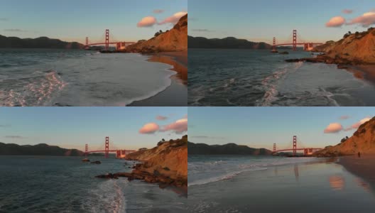 慢动作航空视频-贝克的海滩在旧金山，加州的金门大桥日落高清在线视频素材下载