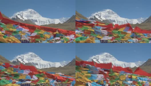 近景:狂风扫过山顶的积雪，使彩旗飘扬高清在线视频素材下载