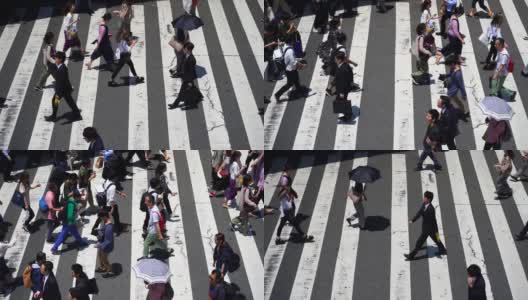 在日本大阪梅田，人们正在走人行横道高清在线视频素材下载