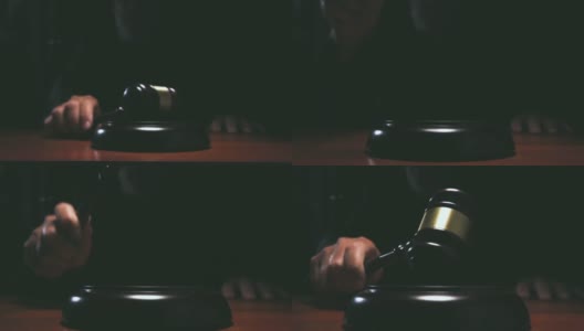 法官在法庭上击打小木槌，黑暗背景慢镜头拍摄高清在线视频素材下载