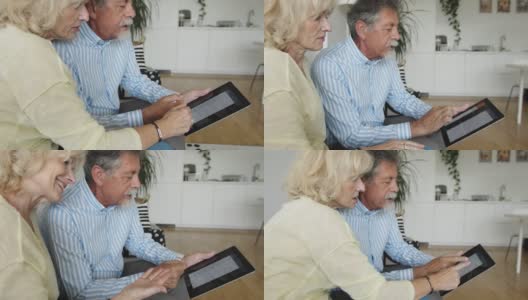 老年夫妇学习如何使用新技术-网上银行高清在线视频素材下载