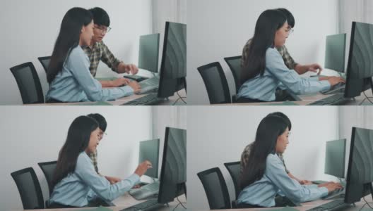 两个亚洲团队工作开发编程和加密技术网站设计程序员在办公桌办公。高清在线视频素材下载