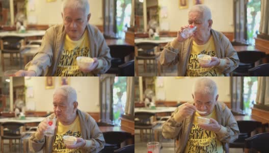 一个老人在中国餐馆吃饭。高清在线视频素材下载