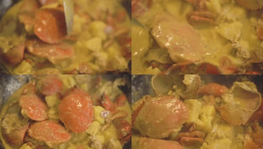 黑蟹菠萝咖喱的特写，在锅里烹饪泰国菜高清在线视频素材下载