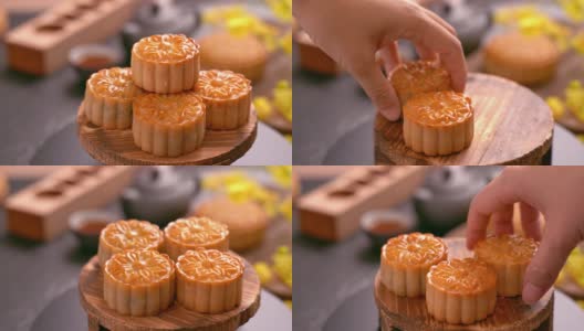 女人拿着漂亮的月饼糕点和家人一起吃，庆祝中秋节。聚会活动的概念高清在线视频素材下载