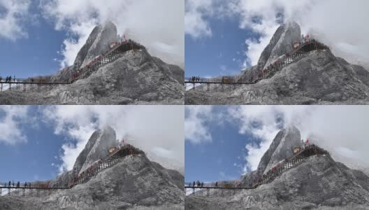 游客爬上玉龙雪山或玉龙雪山的山子斗最高峰的航拍镜头，中国云南丽江高清在线视频素材下载