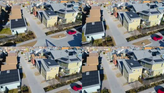太阳能电池板社区屋顶太阳能电池板横跨郊区无人机视图高清在线视频素材下载