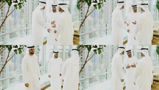 穿着民族服装的阿联酋男子开会时握手高清在线视频素材下载