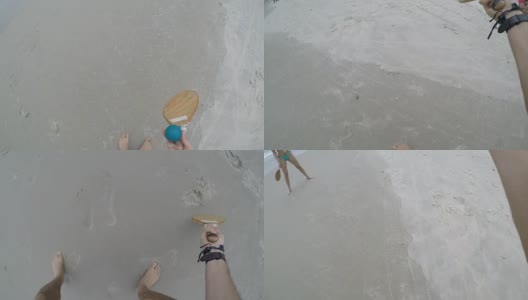一对情侣在沙滩上玩壁画高清在线视频素材下载