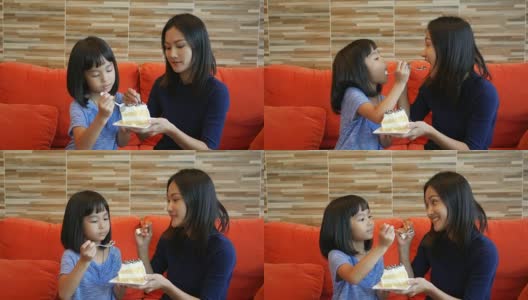 女孩和妈妈在咖啡店吃蛋糕高清在线视频素材下载