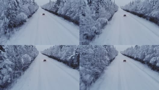 瑞典一架无人机在雪地里跟踪一辆汽车高清在线视频素材下载