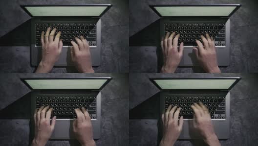 男人的手在笔记本电脑上打字，工作，强光高清在线视频素材下载
