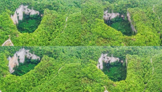 地面下沉，在原始森林中形成了一个巨大的天坑高清在线视频素材下载