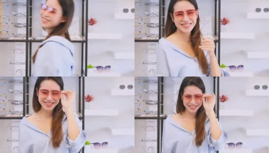 亚洲快乐女人戴太阳镜在眼镜店。高清在线视频素材下载