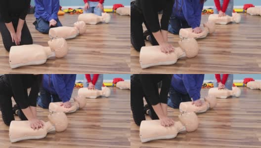 一组青年徒手练习急救训练，心肺复苏术假人急救课程。理念培训技能拯救生命。Cpr人体模型就是一个例子高清在线视频素材下载