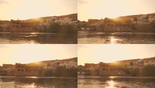 努比亚村庄美丽的日落从一艘船在小镇附近的Answer。埃及高清在线视频素材下载