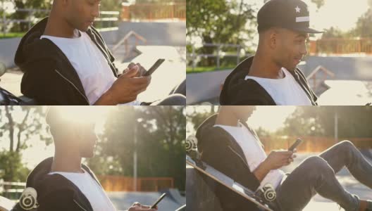 微笑的非洲男子一边玩滑板一边看向一边用智能手机聊天高清在线视频素材下载