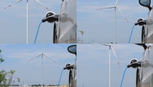 特斯拉电动汽车在刮风天气使用替代能源充电高清在线视频素材下载