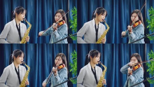 作为古典乐队成员的亚洲女性正在录音室为音乐会做准备。高清在线视频素材下载