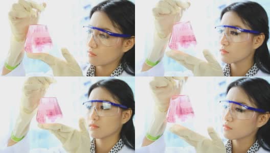 亚洲科学家女性寻找化学液体。高清在线视频素材下载