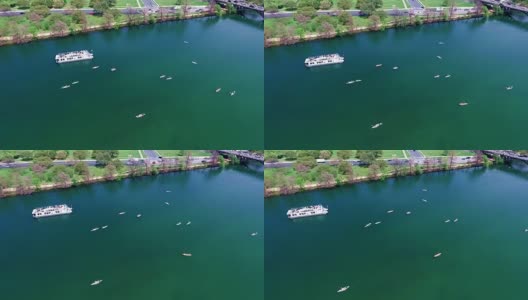 鸟瞰图奥斯汀德克萨斯州科罗拉多河有趣的温泉活动与皮划艇和派对船在SXSW春假2016高清在线视频素材下载