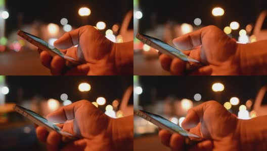 男人在用智能手机，晚上高清在线视频素材下载