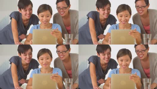 中国的商业女性愉快地使用着平板电脑高清在线视频素材下载