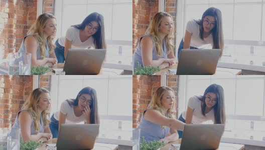 商务女性在手提电脑上讨论4k高清在线视频素材下载