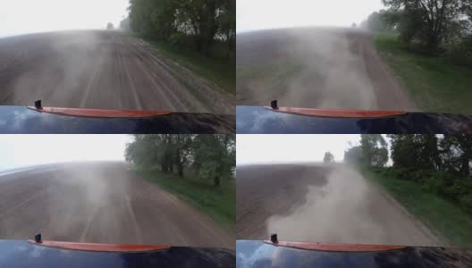 尘土从车轮升起，汽车行驶在农村的砾石路上。高清在线视频素材下载