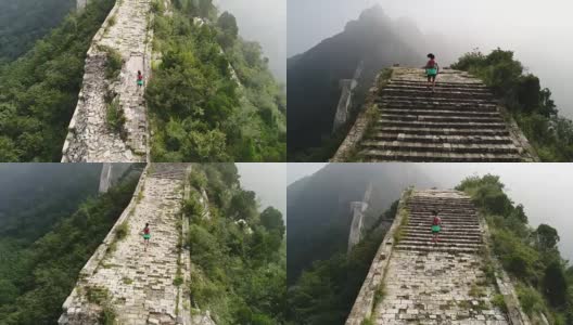 鸟瞰图的年轻的健身妇女越野跑跑在长城的顶端高清在线视频素材下载